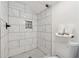 Stylish bathroom features a tiled shower with a decorative mosaic tile accent at 2060 Panstone Sw Ct, Marietta, GA 30060