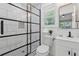 Bathroom featuring shower with stylish tile and glass door, modern vanity, and patterned tile floor at 2060 Panstone Sw Ct, Marietta, GA 30060