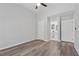 Bright bedroom features modern ceiling fan, wood-look floors, and ensuite bathroom at 2060 Panstone Sw Ct, Marietta, GA 30060