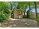 Charming two-story house boasts a balcony, complemented by a lush, tree-filled yard at 2060 Panstone Sw Ct, Marietta, GA 30060