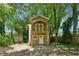 Charming two-story house boasts a balcony, complemented by a lush, tree-filled yard at 2060 Panstone Sw Ct, Marietta, GA 30060