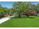 Lovely one-story home featuring mature trees and a spacious green lawn at 2060 Panstone Sw Ct, Marietta, GA 30060