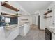 Open concept kitchen features granite counters, modern shelving and plenty of counter space at 2060 Panstone Sw Ct, Marietta, GA 30060