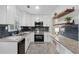 Modern kitchen with granite countertops, subway tile backsplash, and stainless steel appliances at 2060 Panstone Sw Ct, Marietta, GA 30060