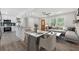 Open-concept living space with modern furnishings and seamless kitchen access at 2060 Panstone Sw Ct, Marietta, GA 30060
