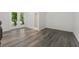 Inviting living area with wood-look floors and access to a private outdoor patio at 2060 Panstone Sw Ct, Marietta, GA 30060