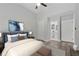 The main bedroom is furnished with a bed, ottoman and features an attached bathroom at 2060 Panstone Sw Ct, Marietta, GA 30060