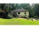 The backyard features a deck, stairs, a bench, and lush green grass at 2985 Heather Stone Way, Lawrenceville, GA 30043