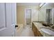 Bathroom featuring double sinks, granite countertops, bathtub, and walk-in shower at 2985 Heather Stone Way, Lawrenceville, GA 30043