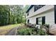 This home has lush landscaping and a paved walkway leading up to the house at 2985 Heather Stone Way, Lawrenceville, GA 30043