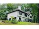 The side view of the two-story home reveals black shutters and an inviting entrance at 2985 Heather Stone Way, Lawrenceville, GA 30043