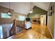 Spacious living room featuring hardwood floors, a brick fireplace, and large windows for ample natural light at 2985 Heather Stone Way, Lawrenceville, GA 30043