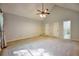 Expansive main bedroom featuring vaulted ceilings, plush carpeting, and multiple closets at 2985 Heather Stone Way, Lawrenceville, GA 30043