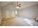 Large main bedroom featuring vaulted ceilings, plush carpeting, and multiple closets at 2985 Heather Stone Way, Lawrenceville, GA 30043