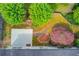 An aerial view of backyard with lush landscaping and a Japanese maple tree at 3585 Berkeley Park Ct, Duluth, GA 30096