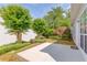 A patio with lush landscaping and a Japanese maple tree at 3585 Berkeley Park Ct, Duluth, GA 30096