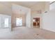 Open dining room with a large window, neutral carpet, and adjacent access to the kitchen and sunroom at 3585 Berkeley Park Ct, Duluth, GA 30096