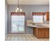 Kitchen area offering wood cabinets, a drop in sink, and a window for natural light at 3585 Berkeley Park Ct, Duluth, GA 30096