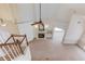 Spacious living room with vaulted ceilings, fireplace, and large ceiling fan, viewed from above at 3585 Berkeley Park Ct, Duluth, GA 30096