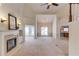 Bright living room featuring a fireplace, vaulted ceilings, neutral colors, and a seamless transition to the sunroom at 3585 Berkeley Park Ct, Duluth, GA 30096