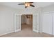 View of an office with french doors leading to the home's staircase and a closet with double doors at 3585 Berkeley Park Ct, Duluth, GA 30096