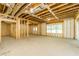 Spacious unfinished basement area with exposed ceiling and natural light from the windows at 7080 Driskell Cir, Cumming, GA 30041