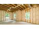 Unfinished basement walls with insulation and windows, ready for customization and personalization at 7080 Driskell Cir, Cumming, GA 30041