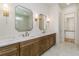 Elegant bathroom featuring double vanity, marble countertops and tile flooring at 7080 Driskell Cir, Cumming, GA 30041