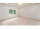 Bedroom featuring a large window with a view and white walls with recessed lighting at 7080 Driskell Cir, Cumming, GA 30041