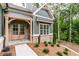 Inviting entrance exhibiting an arched doorway with stylish brick accents at 7080 Driskell Cir, Cumming, GA 30041