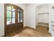 Elegant entrance highlighting a mudroom and beautiful double glass doors at 7080 Driskell Cir, Cumming, GA 30041