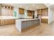 Gourmet kitchen with marble island, custom cabinets, and stainless appliances at 7080 Driskell Cir, Cumming, GA 30041
