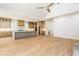 Open kitchen and living area with stainless appliances and vaulted ceiling at 7080 Driskell Cir, Cumming, GA 30041