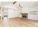 Spacious living room boasts hardwood floors, fireplace, and vaulted ceiling at 7080 Driskell Cir, Cumming, GA 30041