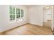 Bright room filled with natural light and featuring beautiful hardwood floors at 7080 Driskell Cir, Cumming, GA 30041