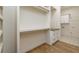 Custom walk-in closet with built-in shelving and drawers, offering ample storage solutions at 7080 Driskell Cir, Cumming, GA 30041