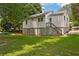 This home has a large backyard with a basement entrance and stairs leading to the main floor at 1891 8Th St, Atlanta, GA 30341