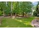 Lush backyard with mature trees, providing ample shade and privacy for outdoor enjoyment at 1891 8Th St, Atlanta, GA 30341