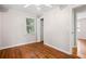Bedroom with hardwood floors, a closet, and a window at 1891 8Th St, Atlanta, GA 30341