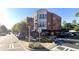 A beautiful three-story mixed-use building with street parking on a sunny day at 1891 8Th St, Atlanta, GA 30341