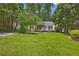 Charming home with well-maintained lawn, and a variety of decorative plants at 1891 8Th St, Atlanta, GA 30341