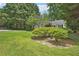 Well-manicured front yard featuring lush lawn, decorative plants, and a beautiful home at 1891 8Th St, Atlanta, GA 30341