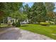 Home with an expansive green lawn and mature landscaping adding to its curb appeal at 1891 8Th St, Atlanta, GA 30341