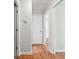 Hallway with hardwood floors leading to multiple rooms with neutral paint at 1891 8Th St, Atlanta, GA 30341