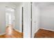 Hallway with hardwood floors and entry to bathroom and kitchen at 1891 8Th St, Atlanta, GA 30341