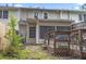 Backyard featuring wooden deck, a grassy area, and wood fence at 244 Timber Creek Sw Ln, Marietta, GA 30060