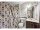 Bathroom with shower-tub combo, stylish vanity, and modern lighting at 244 Timber Creek Sw Ln, Marietta, GA 30060