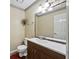 Well-lit half bath features a modern vanity with a decorative framed mirror at 244 Timber Creek Sw Ln, Marietta, GA 30060