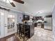 Open kitchen featuring dark wood cabinets, stainless steel appliances, and breakfast bar with seating at 244 Timber Creek Sw Ln, Marietta, GA 30060