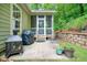 Backyard patio with grill, fireplace, and a retaining wall, perfect for outdoor entertaining at 3286 Crawford Cir, Marietta, GA 30066